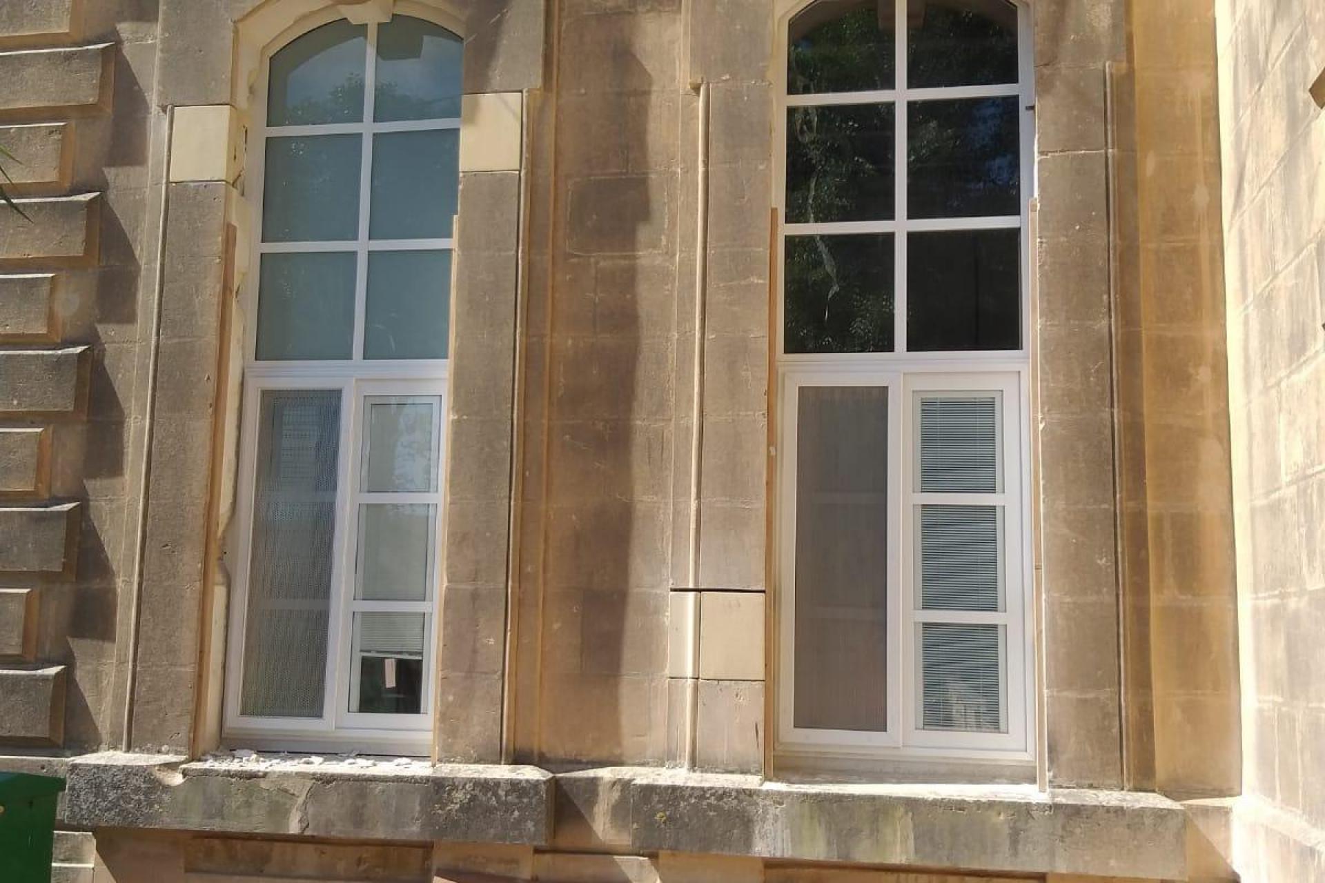 with blinds inside glass